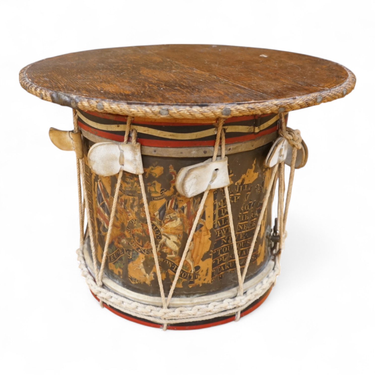 A late 19th/early 20th century Royal East Kent Regiment 'Buffs' regimental drum, 37cm diameter, 37cm high, together with a rope edged, stained pine removable 'table top' adaption